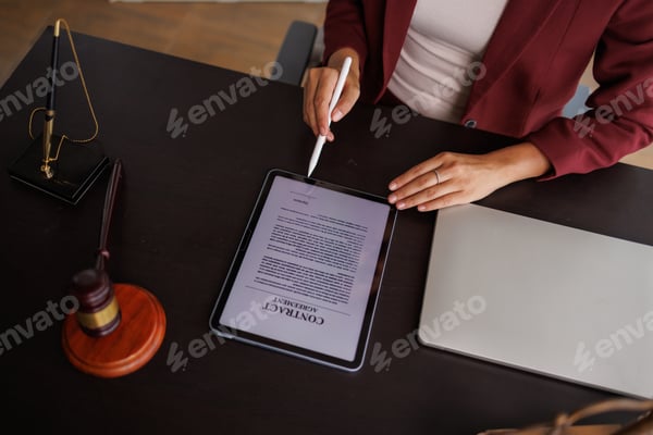 A professional signing a digital contract